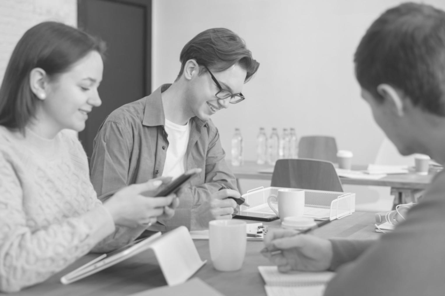 Professional budget negotiation meeting with documents and charts